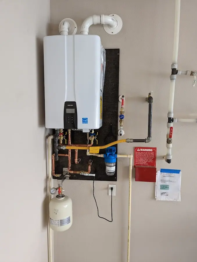 Professional plumber installing copper piping in a East Cocalico home